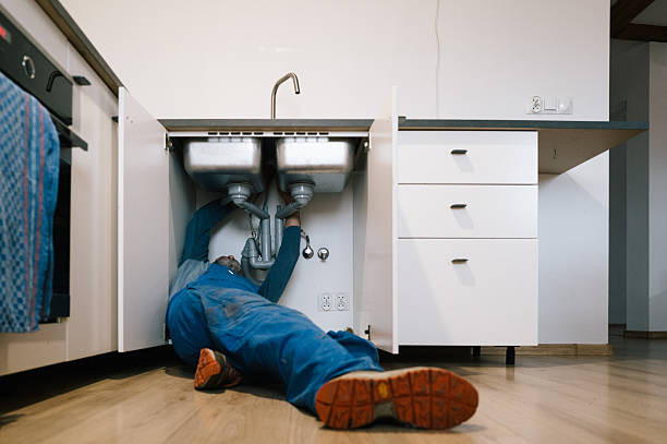 Professional Drain Cleaning technician working in Ellendale, ND